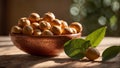 Macadamia nut with leaves a bowl wooden table tasty