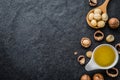 The Macadamia Nut Oil and peeled macadamia nut Royalty Free Stock Photo