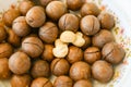 Macadamia nuts on bowl, fresh natural shelled raw macadamia nuts, close up pile of roasted macadamia nut Royalty Free Stock Photo