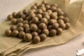 a macadamia nuts on burlap background backdrop Royalty Free Stock Photo