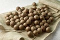 A macadamia nuts on burlap background backdrop Royalty Free Stock Photo