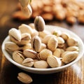 Macadamia nuts falling into bowl Royalty Free Stock Photo