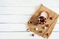 Macadamia nuts in shell on wooden background. Top view Royalty Free Stock Photo