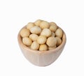 Macadamia in wooden bowl, isolate background Royalty Free Stock Photo