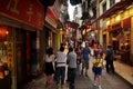 Macanese people and foreign travelers walk travel visit shopping small alley Travessa da Paixao in Senado Senate Square at UNESCO