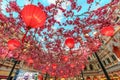 Macao, China - January 24, 2016: Red Chinese lanterns and sakura garlands as indoor decorations under artificial blue sky in The V