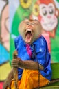 Macaque is yawning during Thailand monkey show.