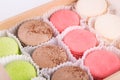 Macaron in a box of cookies of different tastes