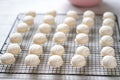 macaron shells cooling on a wire rack