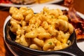 Macaroni and cheese is an American food served in black bowl Royalty Free Stock Photo