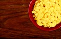 Macaroni and cheese on wood background