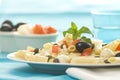 Macaroni mozzarella olives capers tomatoes salad Royalty Free Stock Photo