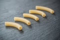 Macaroni pasta on chalkboard background Royalty Free Stock Photo