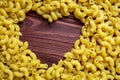 Macaroni Pasta Lover, Dry Macaroni Pasta Texture Background with Heart Shape Copy Space Royalty Free Stock Photo