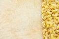 Macaroni rigati Beautiful laid out pasta with the right, side view on a wooden table top with a textured background