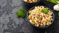 Macaroni Salad with red bell pepper, onion, celery, gherkins and mayonnaise dressing Royalty Free Stock Photo