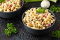 Macaroni Salad with red bell pepper, onion, celery, gherkins and mayonnaise dressing Royalty Free Stock Photo