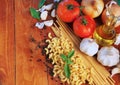 Macaroni and spaghetti ingredients on wood Royalty Free Stock Photo