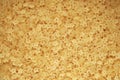 Macaroni stars texture. Italian pasta stellini for soup. Yellow small raw noodles in the shape of a star. Quality photo Royalty Free Stock Photo