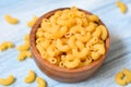 Macaroni top view on wooden bowl background - close up raw macaroni uncooked delicious pasta or penne noodles Royalty Free Stock Photo