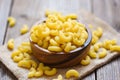 Macaroni top view on wooden bowl background - close up raw macaroni uncooked delicious pasta or penne noodles Royalty Free Stock Photo