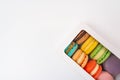 Macarons box on a white table. colorful French macaroons Royalty Free Stock Photo