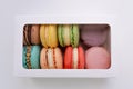 Macarons box on a white table. colorful French macaroons. Royalty Free Stock Photo