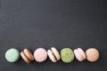 Macarons cake, top view flat lay, macaroon on black background Royalty Free Stock Photo