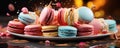 macarons cakes of different colors in blue background. Tasty colourful macaroons