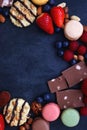 Sweets, Berries And Nuts On Dark Background