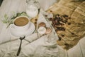 Macarons multicolored and cups with black coffee and on a wooden table with various ingredients, chocolate, coffee Royalty Free Stock Photo