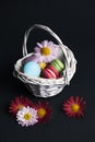 Macaroons in the basket on black background Royalty Free Stock Photo