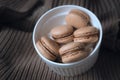 macaroons in a bowl. caramel macaroons on a sweater. cozy autumn photography.