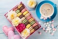 Macaroons and coffee. Sweet macarons in gift box