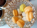 Macarons in crystal ball, orange, yellow and creamy, Italian dessert, 5\'oclock desert,