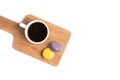 macaroons and a cup of coffee on wooden board Royalty Free Stock Photo