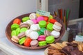 Macaroons on display in a bakery window Royalty Free Stock Photo