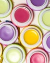 Macaroons form sweet lip balms, bright colors, white background cosmetic