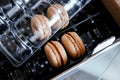 Macaroons per pack. Paper box for transporting cookies Royalty Free Stock Photo