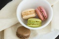 Macaroons in a small white bowl