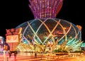 MACAU, CHINA. Grand Lisboa 5-star Hotel in Macau which is the gambling capital of Asia. Entrance view. Night Macao cityscape