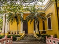 MACAU,CHINA - NOVEMBER 2018: The vibrant yellow Qingcao hall of the Lou Lim Leoc public garden and park Royalty Free Stock Photo