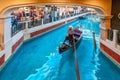 The Venetian Macau Resort Hotel interior view. Gondola sailing in canal Royalty Free Stock Photo