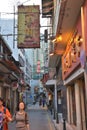 Macau quaint shops tall building street view