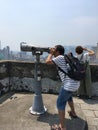 A man looks through binoculars at Monte Fort, Macau Royalty Free Stock Photo