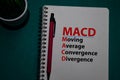 MACD - Moving Average Convergence Divergence acronym write on a book isolated on Office Desk Royalty Free Stock Photo