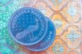 Macedonia currency denar on the banknote pattern background, close up. Photo depicts Macedonian cash shiny denari metal coins, cl Royalty Free Stock Photo
