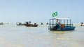 Maceio, Brazil - September, 05 2017. Brazilian coast with several boats moored on the coast. The flag of Brazil is in one of them.