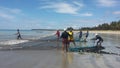 MaceiÃÂ³, Brazil - 30 october 2019 - Fishermen pulling a fishnet on the beach