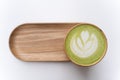 Macha Latte Cup on a Wooden Plate Isolated.